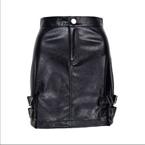 Faux leather skirt with buckles on side